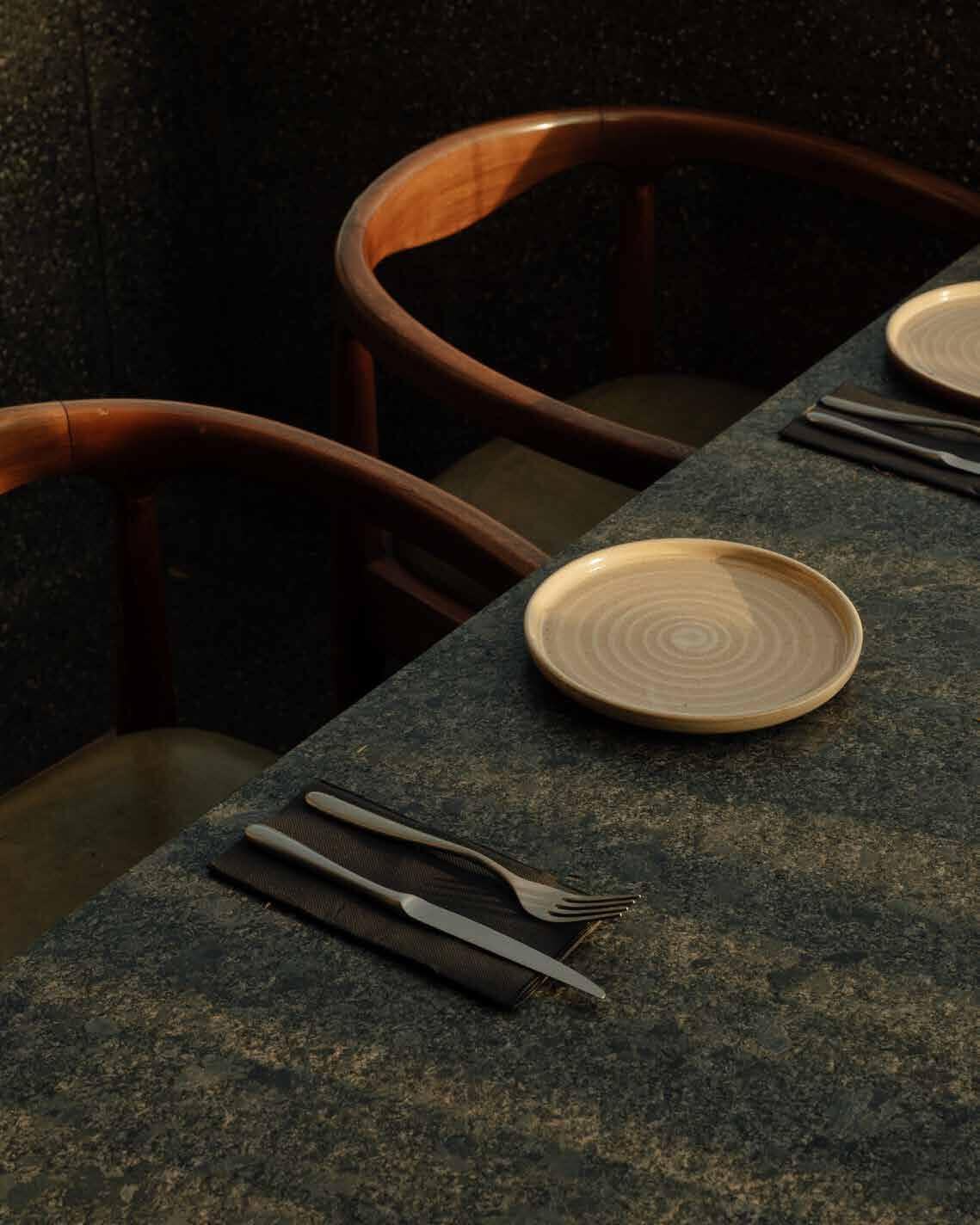 Table detail with ceramic plate at Mal de Ojo
