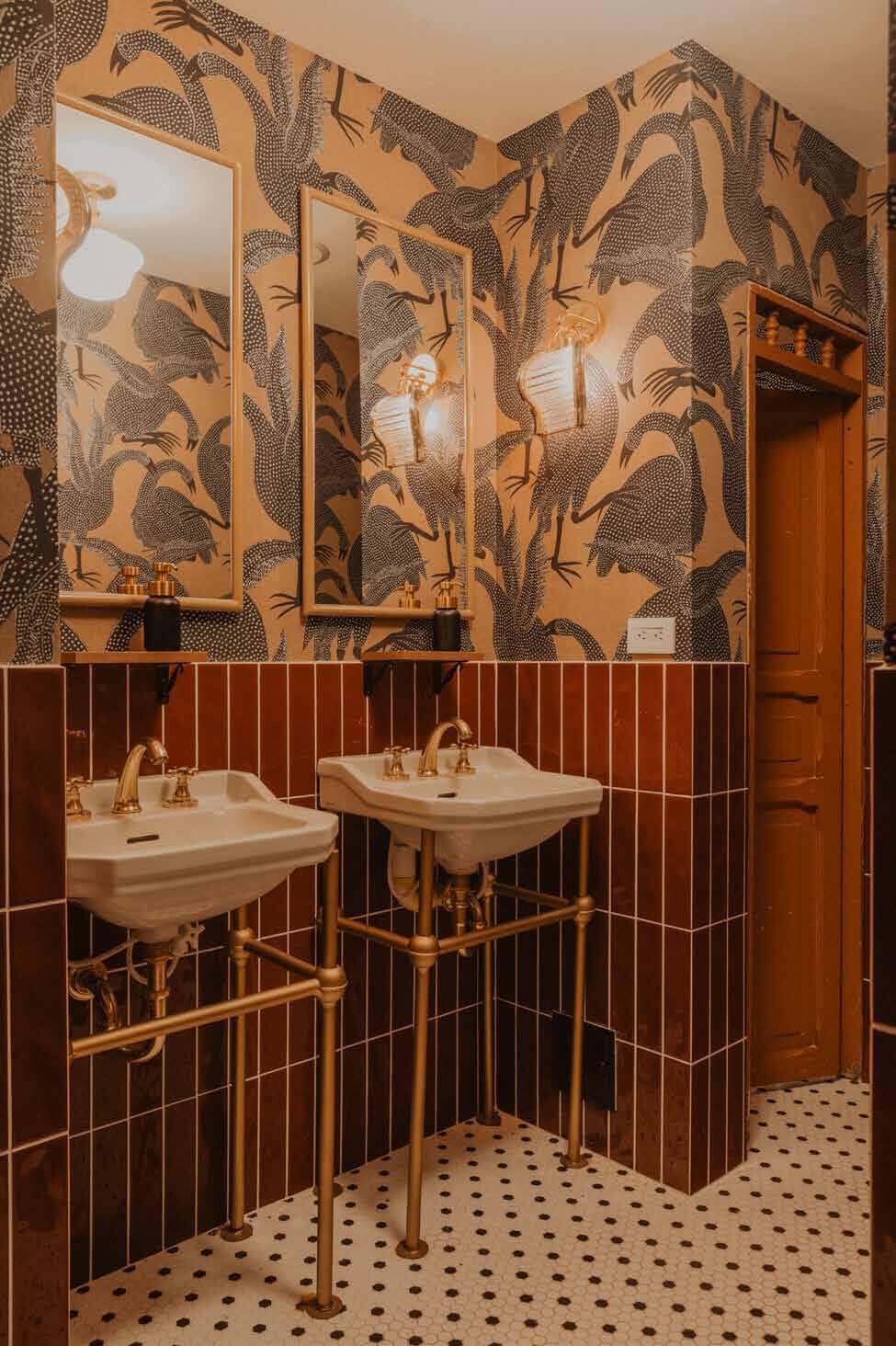 Bathroom at Quema que Quema with brass basins and bird wallpaper
